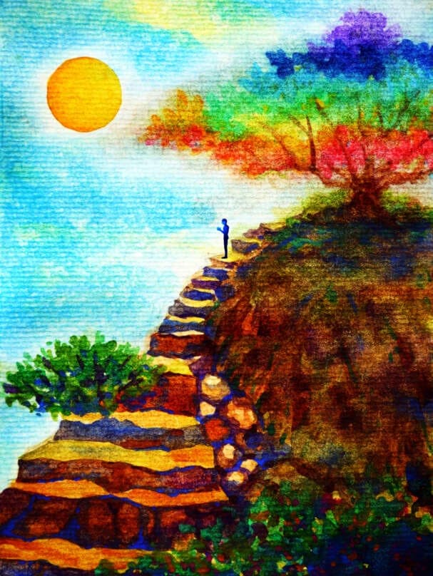 A person sitting on a rock, contemplating